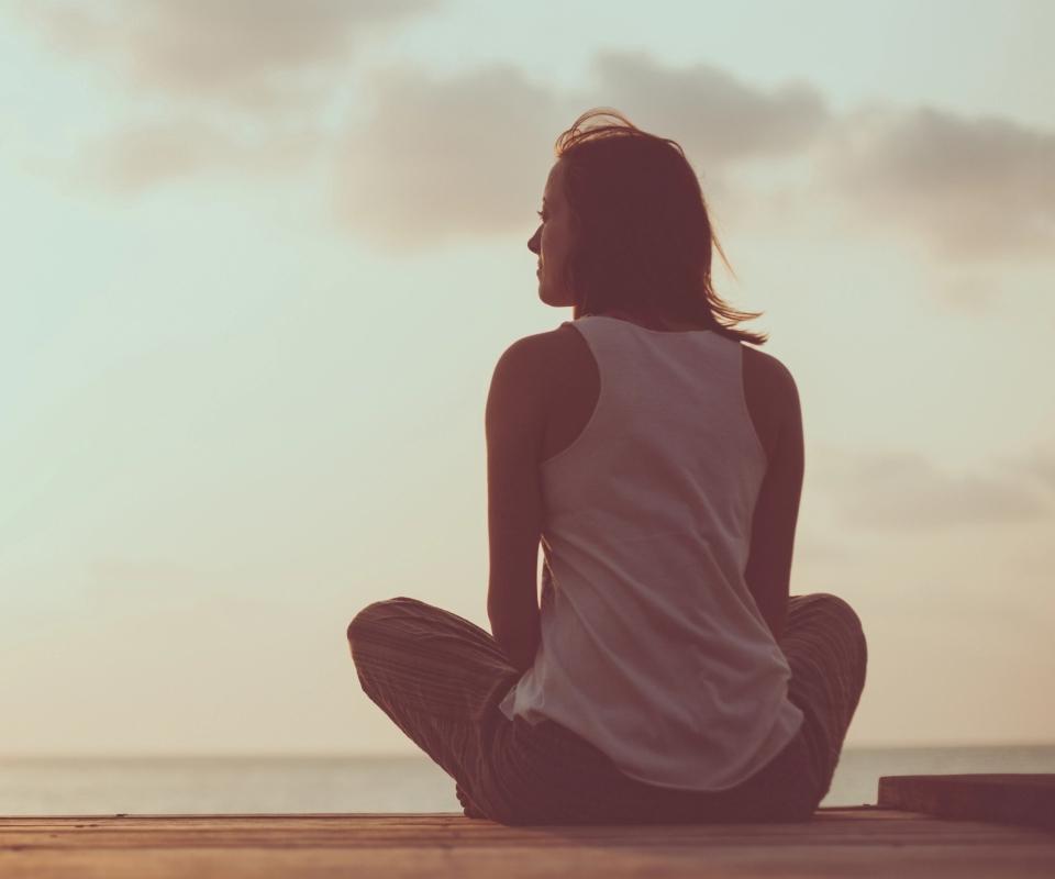 Girl sitting on the beach